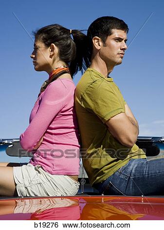 man and woman next to a red convertible View Large Photo Image Stock Photograph - man and woman next to a red convertible. Fotosearch