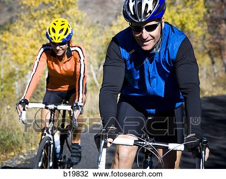 man and woman on road bicycles View Large Photo Image Stock Image - man and woman on road bicycles. Fotosearch