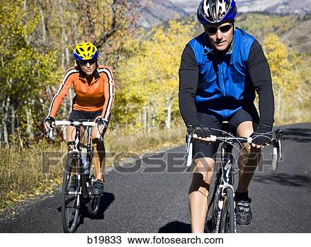 man and woman on road bicycles View Large Photo Image Stock Image - man and woman on road bicycles. Fotosearch