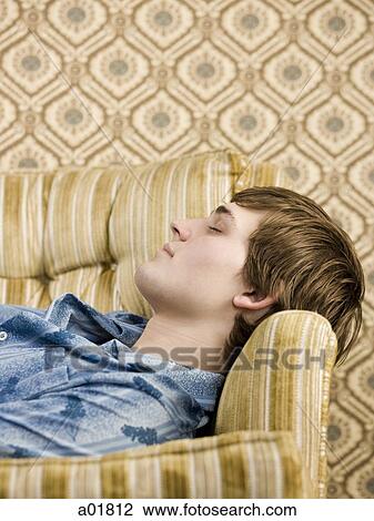 man asleep on the couch View Large Photo Image Stock Image - man asleep on the couch. Fotosearch