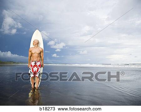 Stock Image - Man at the beach.. Fotosearch