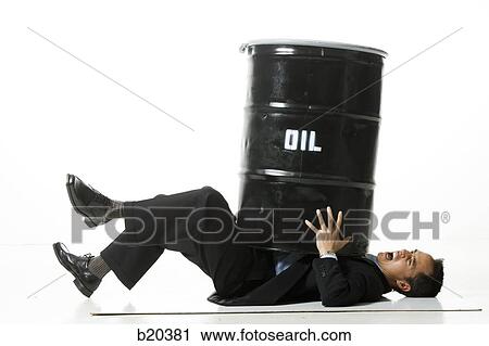 Stock Image - man being crushed by an oil barrel. Fotosearch