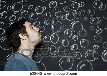 man blowing bubbles View Large Photo Image Stock Image - man blowing bubbles. Fotosearch