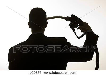 Stock Photograph - man holding a gas pump to his head. Fotosearch