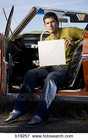 man in a red convertible View Large Photo Image Stock Photo - man in a red convertible. Fotosearch