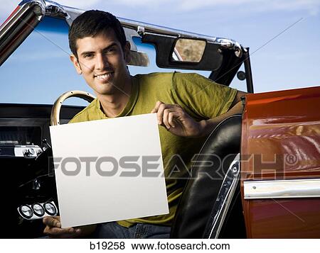 man in a red convertible View Large Photo Image Stock Photo - man in a red convertible. Fotosearch