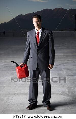 man in a suit with a gas can View Large Photo Image Stock Photo - man in a suit with a gas can. Fotosearch