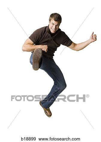 man jumping in the air and kicking. View Large Photo Image Stock Photo - man jumping in the air and kicking.. Fotosearch