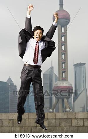 Stock Image - Man jumping in the air.. Fotosearch