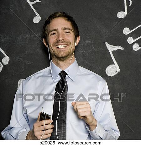 man listening to an mp3 player View Large Photo Image Stock Photography - man listening to an mp3 player. Fotosearch