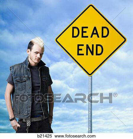 man looking at a dead end sign View Large Photo Image Stock Photography - man looking at a dead end sign. Fotosearch