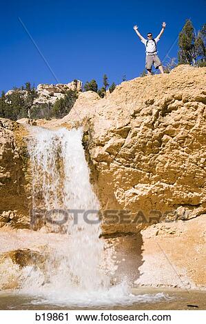 man next to a waterfall View Large Photo Image Stock Image - man next to a waterfall. Fotosearch