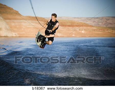 Man on a water ski. View Large Photo Image Stock Photo - Man on a water ski.. Fotosearch