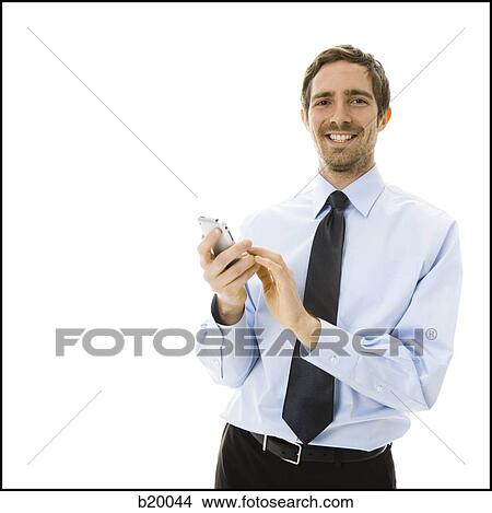 Picture - man on his iPhone. Fotosearch