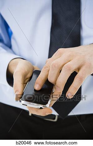 man on his iPhone View Large Photo Image Stock Photograph - man on his iPhone. Fotosearch