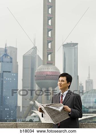 Man reading a newspaper. View Large Photo Image Picture - Man reading a newspaper.. Fotosearch