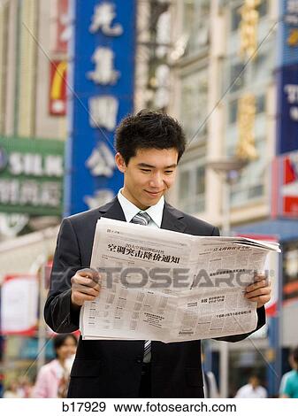 Stock Photo - Man reading a newspaper.. Fotosearch