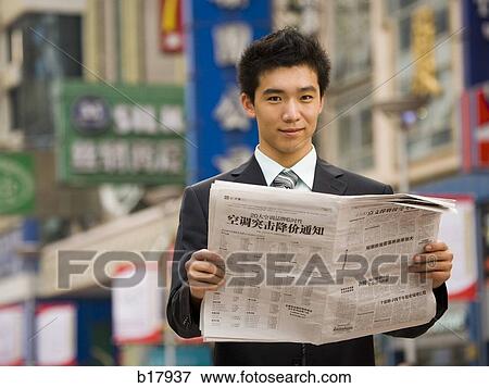 Stock Photo - Man reading a newspaper.. Fotosearch