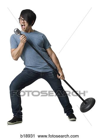 Man rocking out with mic stand. View Large Photo Image Stock Image - Man rocking out with mic stand.. Fotosearch