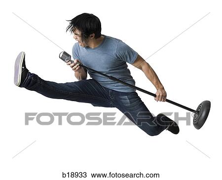 Man rocking out with mic stand. View Large Photo Image Stock Image - Man rocking out with mic stand.. Fotosearch