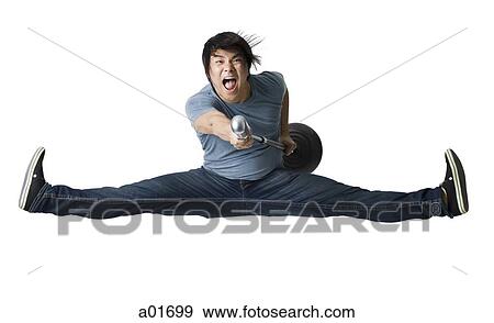 Man rocking out with mic stand. View Large Photo Image Stock Photo - Man rocking out with mic stand.. Fotosearch
