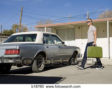 man with a green suitcase and an old car. View Large Photo Image Stock Image - man with a green suitcase and an old car.. Fotosearch