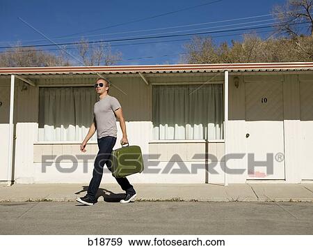 man with a green suitcase. View Large Photo Image Stock Photo - man with a green suitcase.. Fotosearch