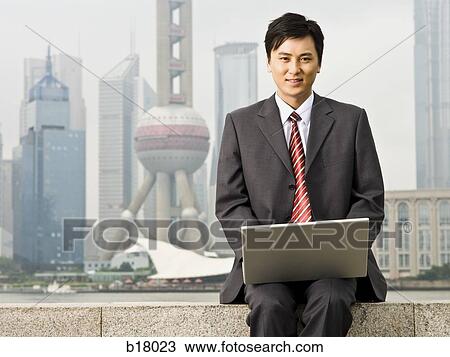 Man with a notebook computer. View Large Photo Image Stock Image - Man with a notebook computer.. Fotosearch