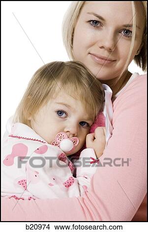 Picture - mother and daughter in pajamas. Fotosearch