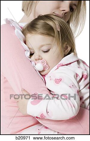 Stock Image - mother and daughter in pajamas. Fotosearch