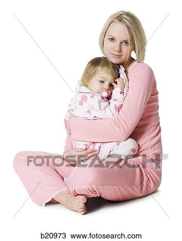 Stock Image - mother and daughter in pajamas. Fotosearch