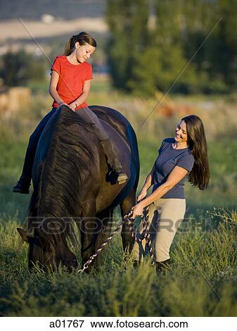 mother and daughter with a horse View Large Photo Image Stock Photo - mother and daughter with a horse. Fotosearch