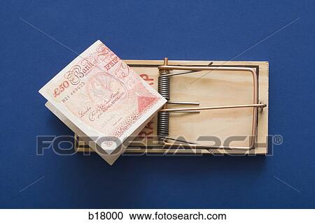 Stock Image - Mouse trap with money as bait.. Fotosearch