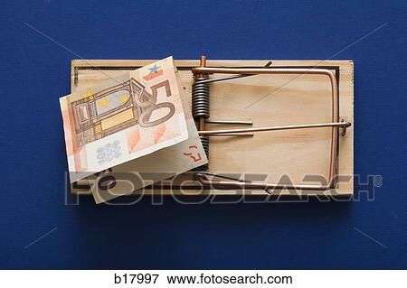Stock Photo - Mouse trap with money as bait.. Fotosearch