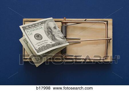 Mouse trap with money as bait. View Large Photo Image Stock Photo - Mouse trap with money as bait.. Fotosearch