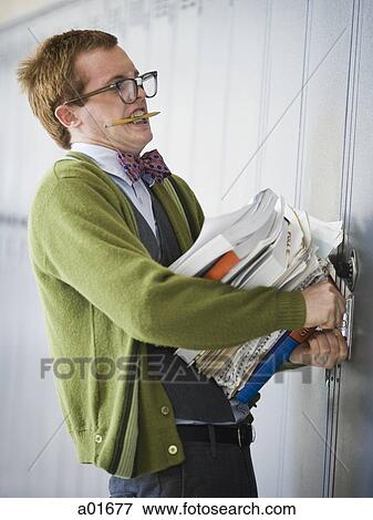 Nerd carrying books.. View Large Photo Image Stock Photo - Nerd carrying books... Fotosearch