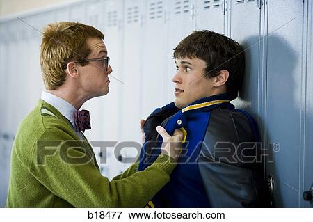 Nerd picking on jock. View Large Photo Image Stock Photo - Nerd picking on jock.. Fotosearch