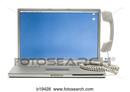 Stock Photo - notebook computer with a telephone handset on it. Fotosearch