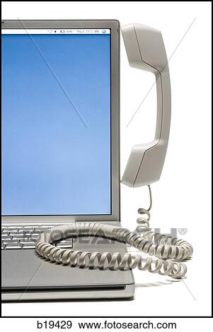 notebook computer with a telephone handset on it View Large Photo Image Stock Photo - notebook computer with a telephone handset on it. Fotosearch