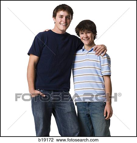 older boy with arm around younger boy. View Large Photo Image Stock Image - older boy with arm around younger boy.. Fotosearch