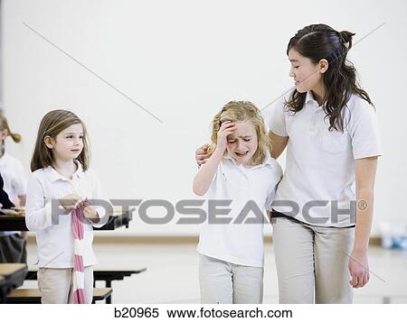 older girl comforting a younger girl View Large Photo Image Stock Photography - older girl comforting a younger girl. Fotosearch
