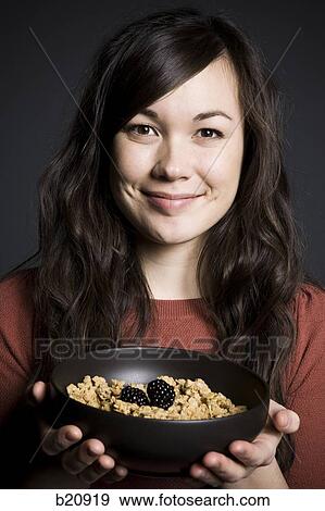 Stock Photo - one young woman only, Caucasian Appearance, One Person, Mixed Race Person, Korean Ethnicity, 20-24 years. Fotosearch