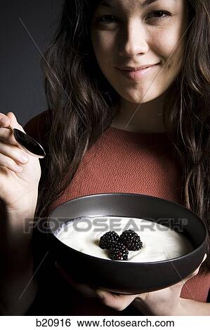 Stock Photograph - one young woman only, Caucasian Appearance, One Person, Mixed Race Person, Korean Ethnicity, 20-24 years. Fotosearch