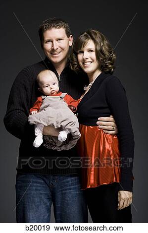 Stock Photo - parents and baby. Fotosearch