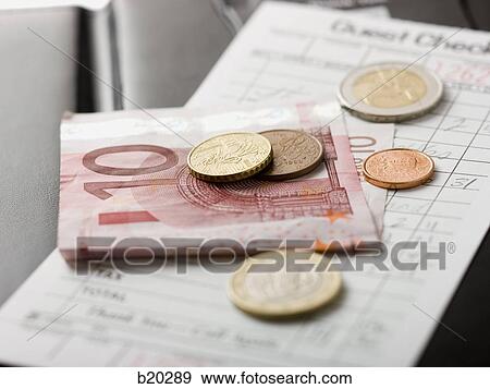 Stock Photo - paying a tab. Fotosearch