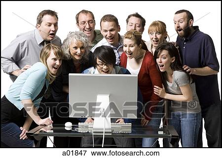 people crowded around a computer View Large Photo Image Stock Photo - people crowded around a computer. Fotosearch