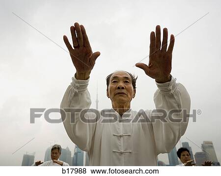 Stock Photo - People practicing Tai Chi.. Fotosearch