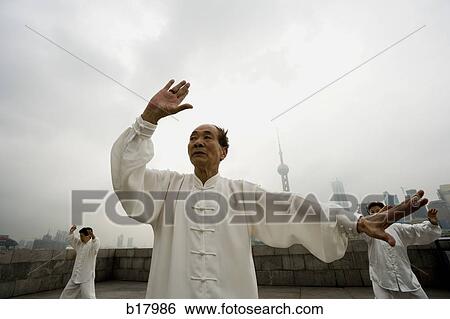 People practicing Tai Chi. View Large Photo Image Stock Photograph - People practicing Tai Chi.. Fotosearch