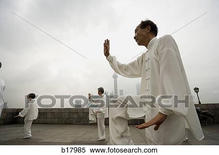 People practicing Tai Chi. View Large Photo Image Stock Photography - People practicing Tai Chi.. Fotosearch