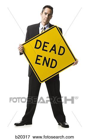 Stock Photo - "person holding a ""dead end"" sign". Fotosearch